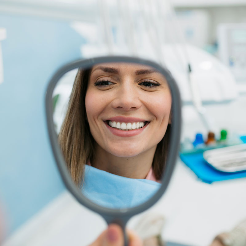 lady smiling in mirror